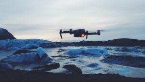Drone flying over a body of water