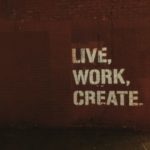 live, work, create painted on a brick wall