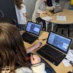 Students using a computer at the Lindsay Makerspace.