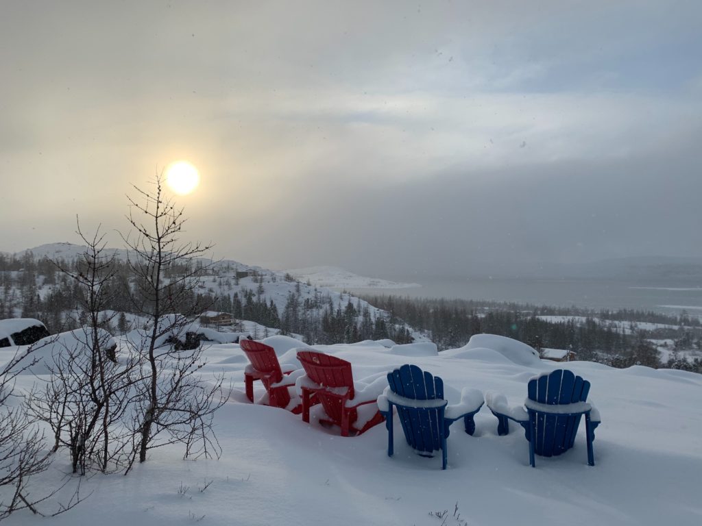 red and blue chairs overlooking breath taking landscape