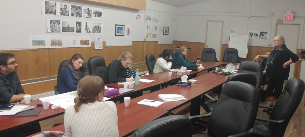 The team meeting with Shirley and Joe to discuss IQ principles in Arviat.