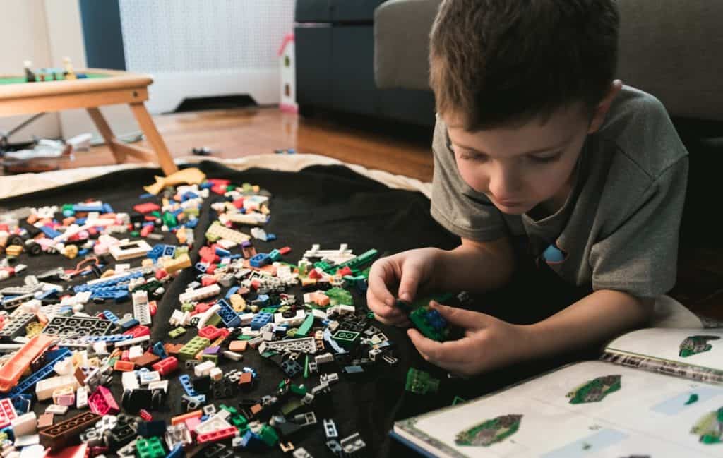 A student playing with Lego.