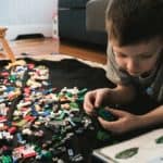 A student playing with Lego.