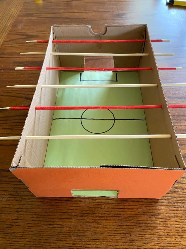 The foosball box with rods added.