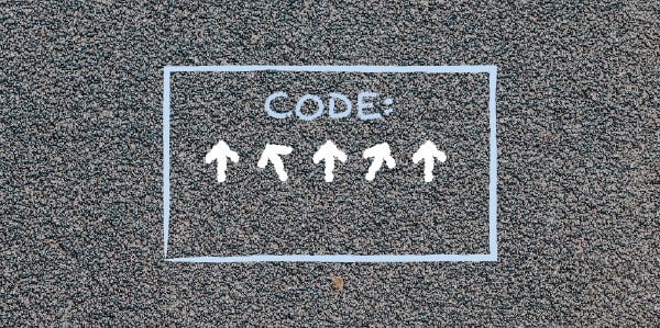 A code box with arrows inside drawn on pavement,