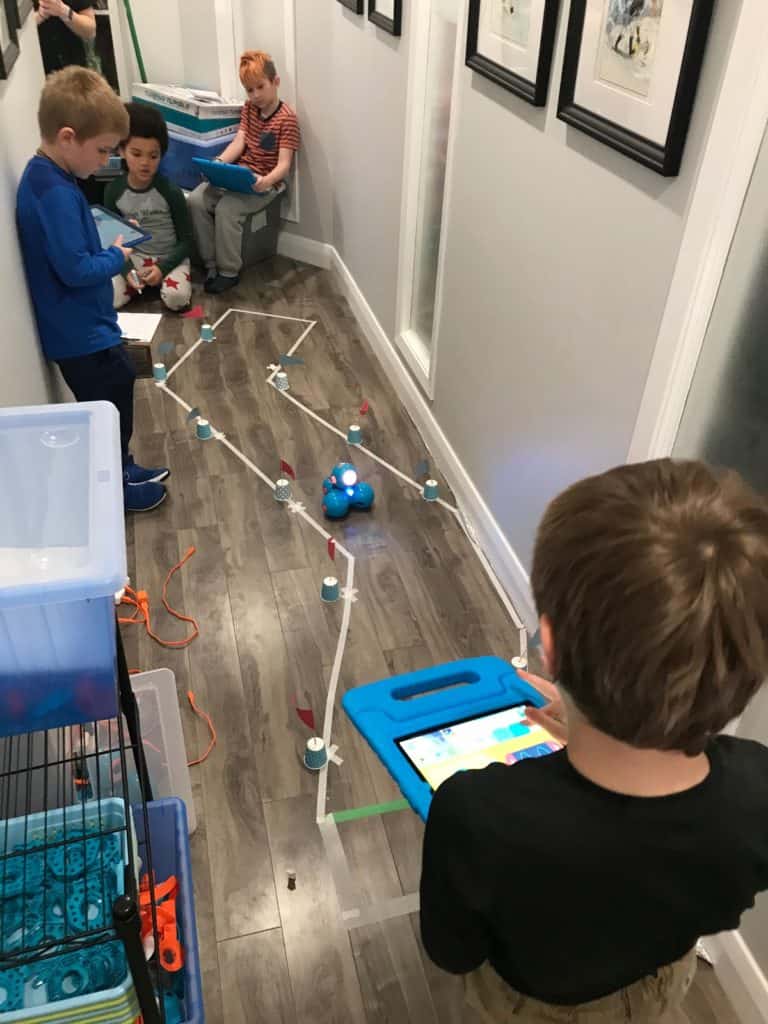 Students in the Lindsay Makerspace using Dash and Dot robots in a group made obstacle course.