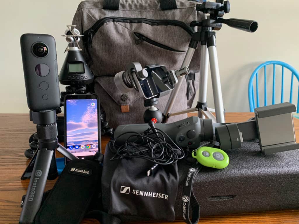 From left to right: Insta 360 One X 360 camera; Android phone; Zoom H3-VR 360 microphone on Gorilla tripod; Sennheiser Clip Mic; Dji Osmo Gimbal (Dji Mobile); Mobile phone with attached Ztylus macro lens and Shure Motiv MV88A mic; Joby universal phone mount; Manfrotto tabletop tripod; Bluetooth shutter; Amazon Basics tripod
