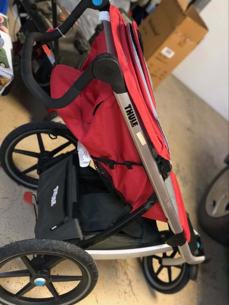 A red THULE stroller.