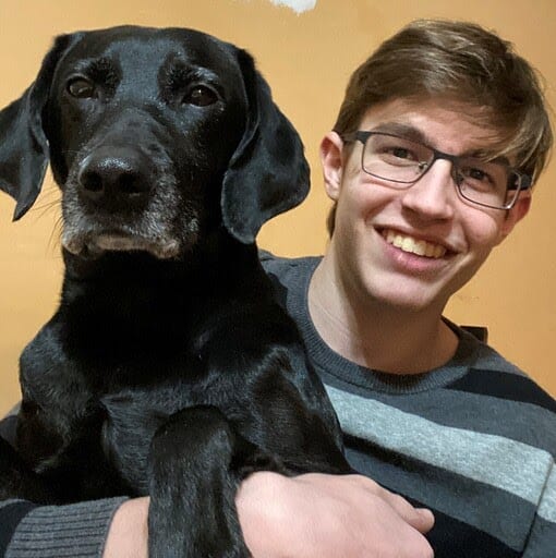 Employee Santino with his dog.